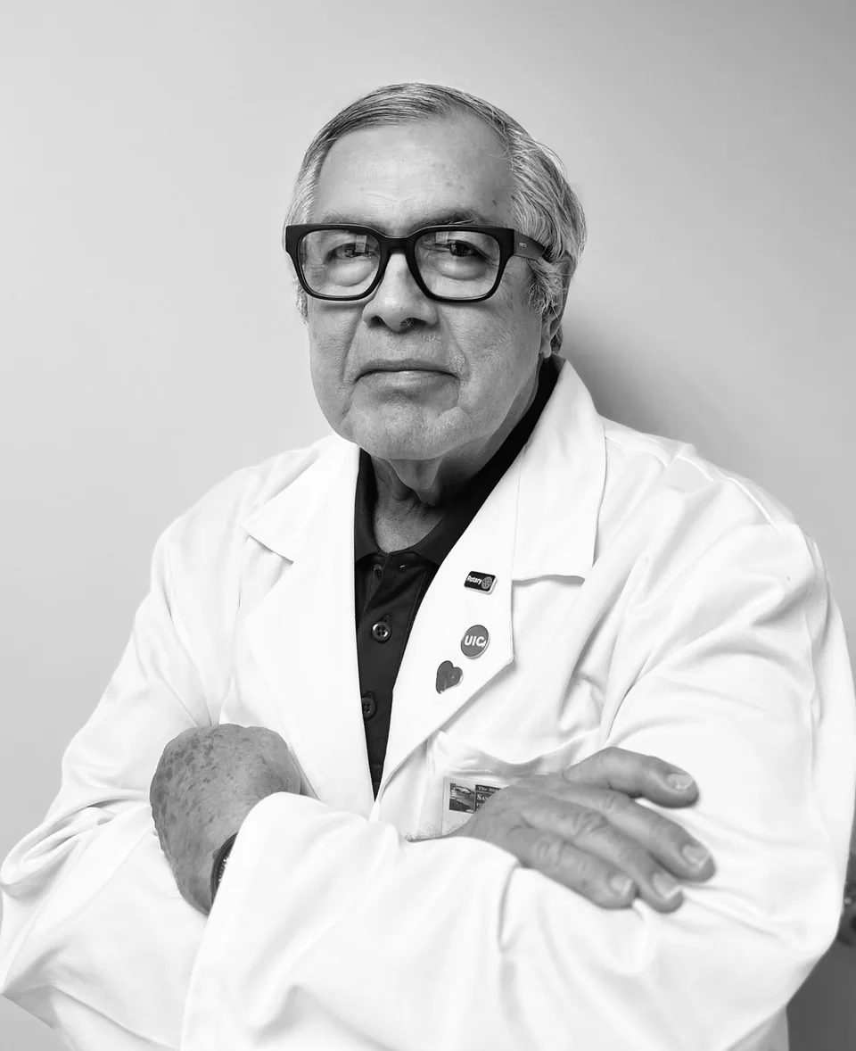 Dr. Joel Juarez-Uribe in his white coat.